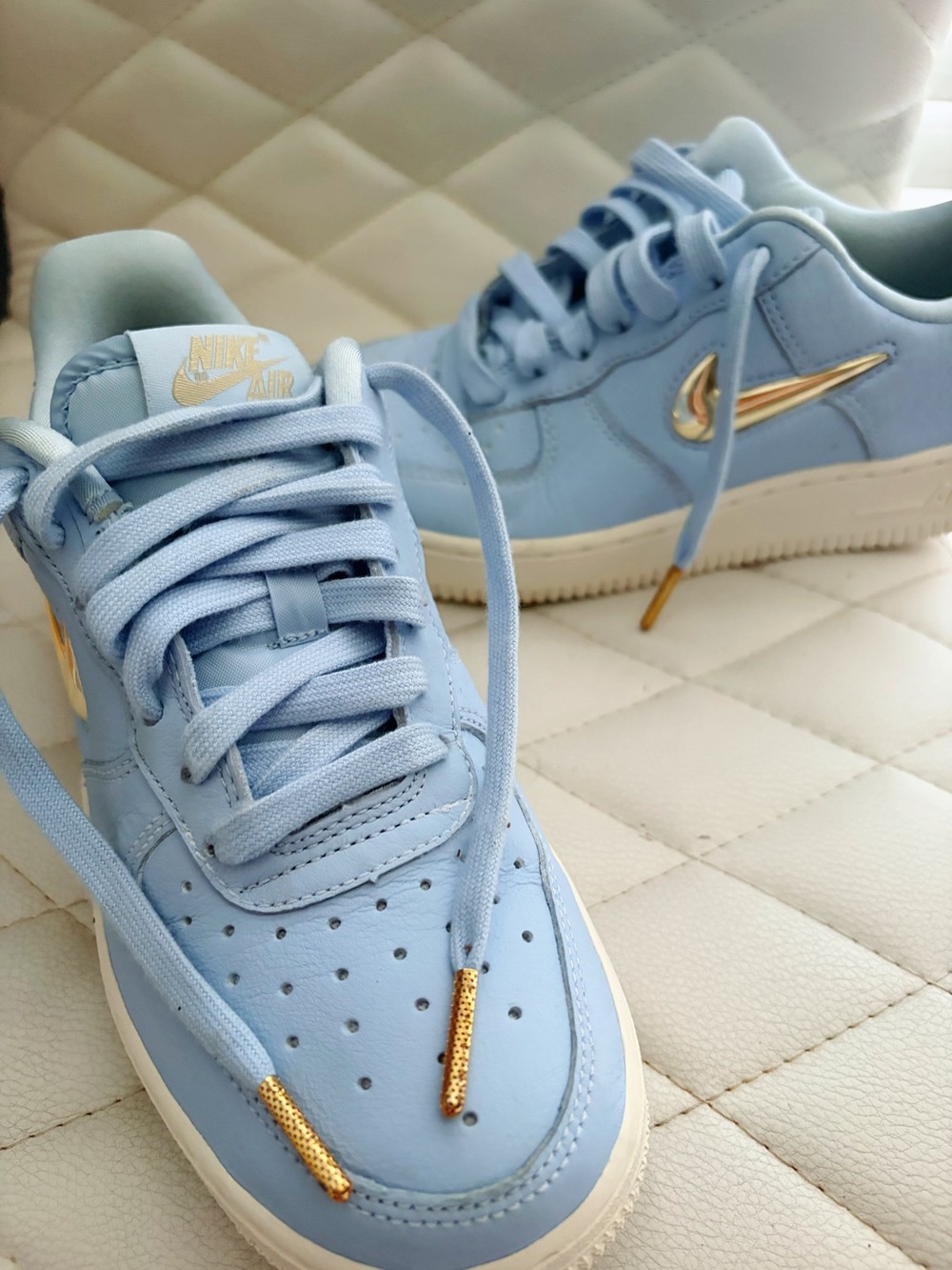 Nike Women’s Light Blue Low-Top Sneakers with Gold Swoosh